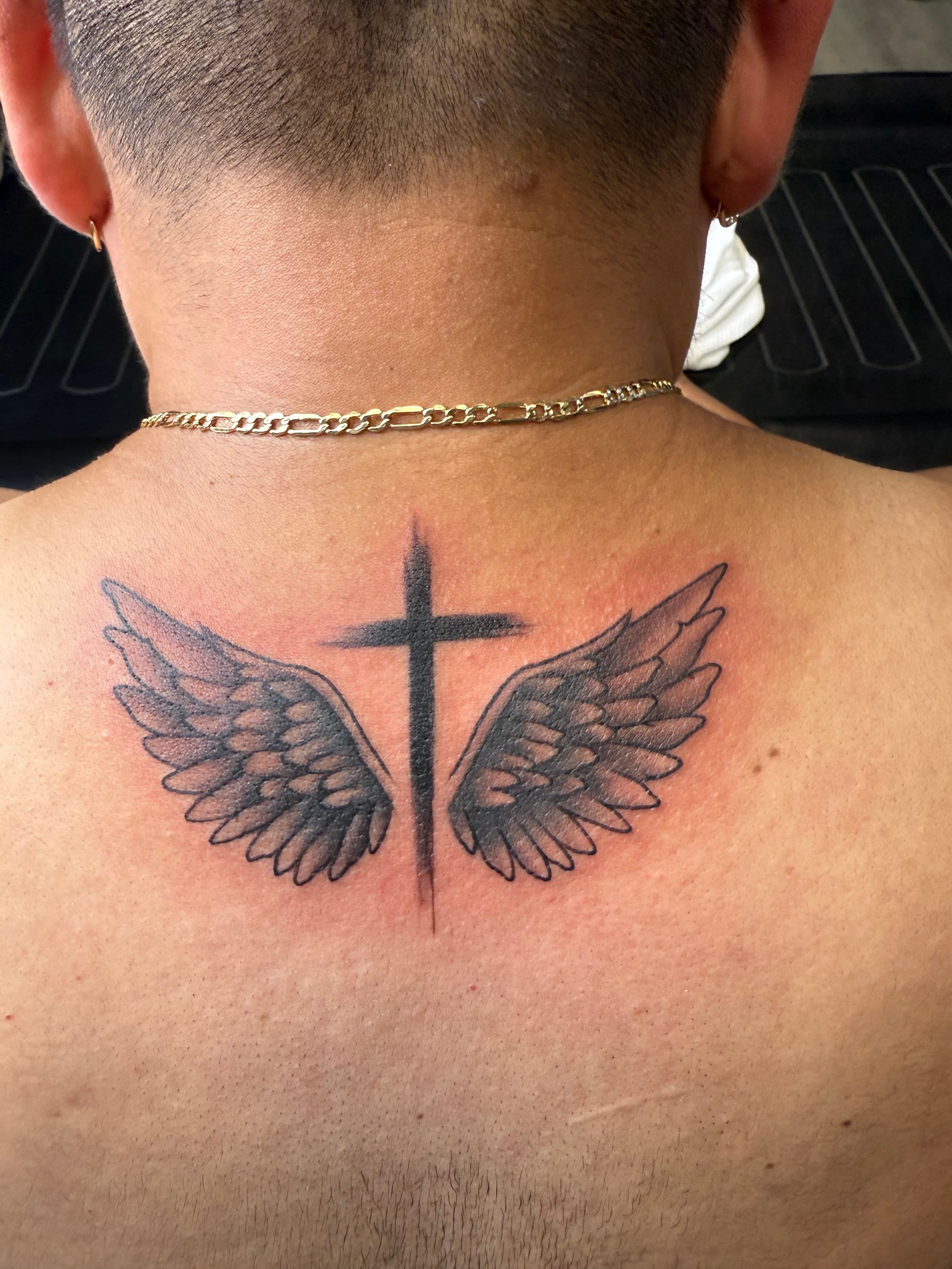 Small wings tattoo